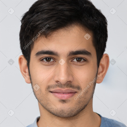 Joyful latino young-adult male with short  brown hair and brown eyes