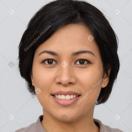 Joyful asian young-adult female with short  brown hair and brown eyes