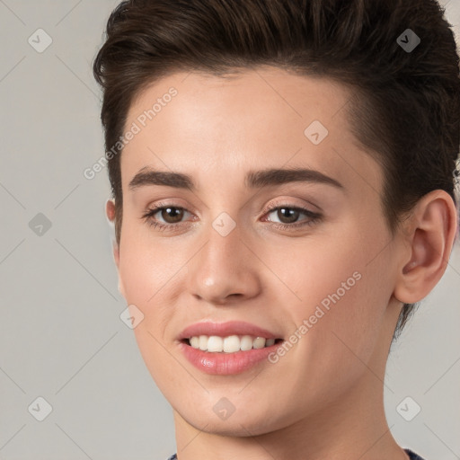 Joyful white young-adult female with short  brown hair and brown eyes