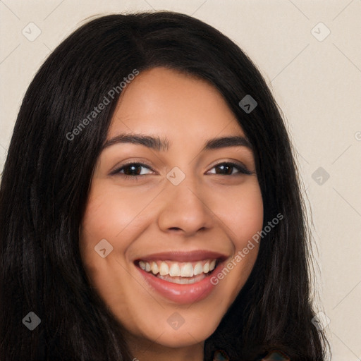 Joyful latino young-adult female with long  brown hair and brown eyes