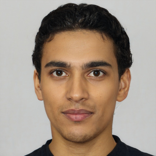 Neutral latino young-adult male with short  black hair and brown eyes