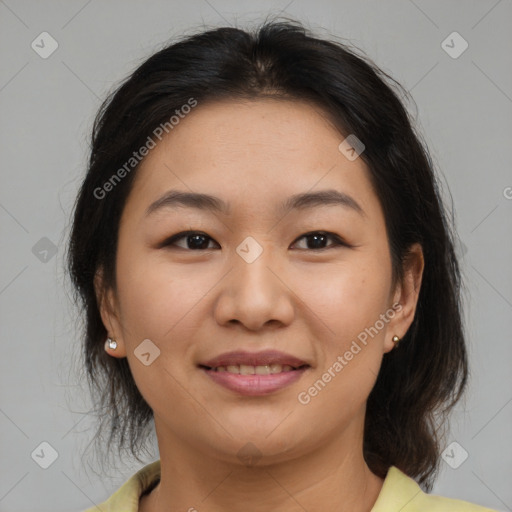 Joyful asian young-adult female with medium  brown hair and brown eyes