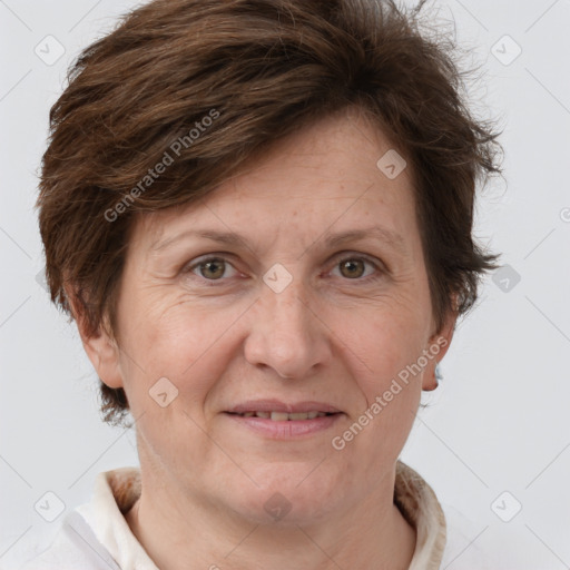 Joyful white adult female with short  brown hair and brown eyes