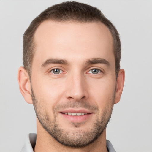 Joyful white young-adult male with short  brown hair and brown eyes