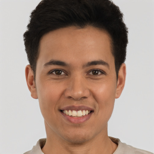 Joyful white young-adult male with short  black hair and brown eyes