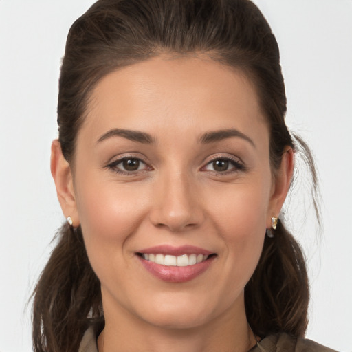 Joyful white young-adult female with medium  brown hair and brown eyes