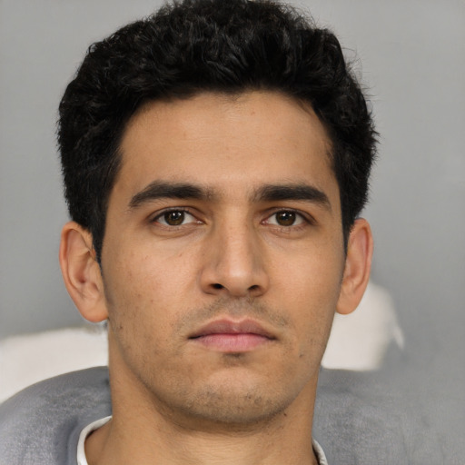 Neutral white young-adult male with short  black hair and brown eyes