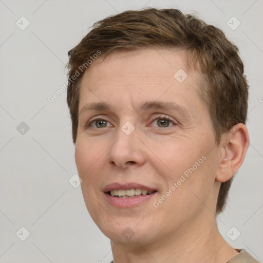 Joyful white adult female with short  brown hair and brown eyes