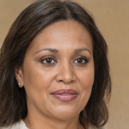 Joyful white adult female with medium  brown hair and brown eyes