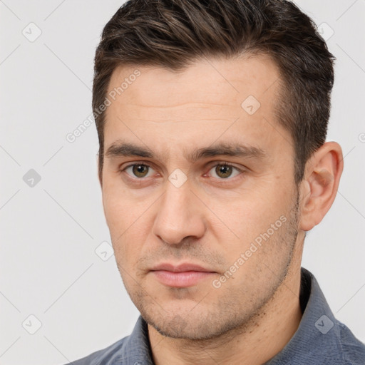 Neutral white adult male with short  brown hair and brown eyes