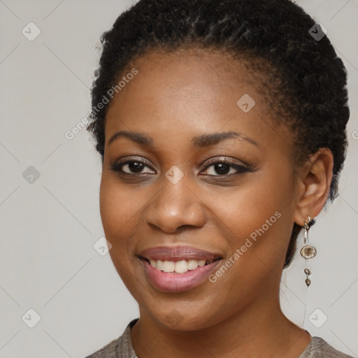 Joyful black young-adult female with short  brown hair and brown eyes