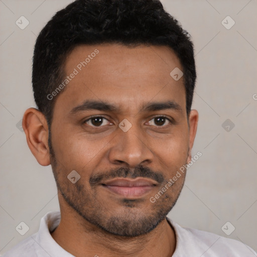 Joyful black young-adult male with short  brown hair and brown eyes