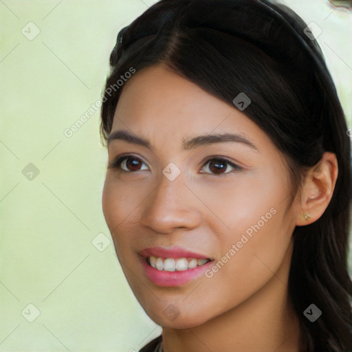 Joyful latino young-adult female with long  black hair and brown eyes