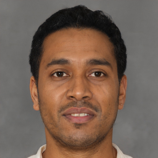 Neutral latino young-adult male with short  black hair and brown eyes