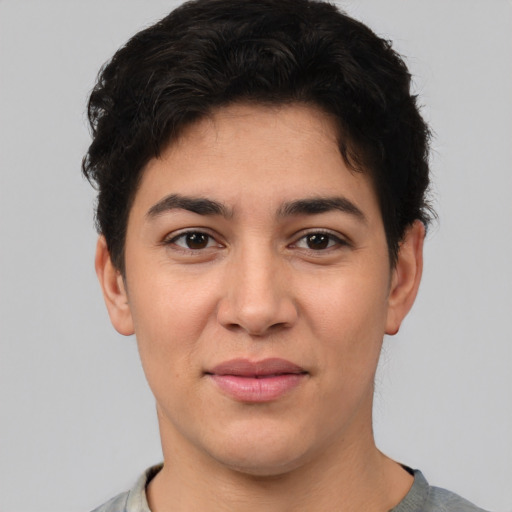 Joyful white young-adult female with short  black hair and brown eyes