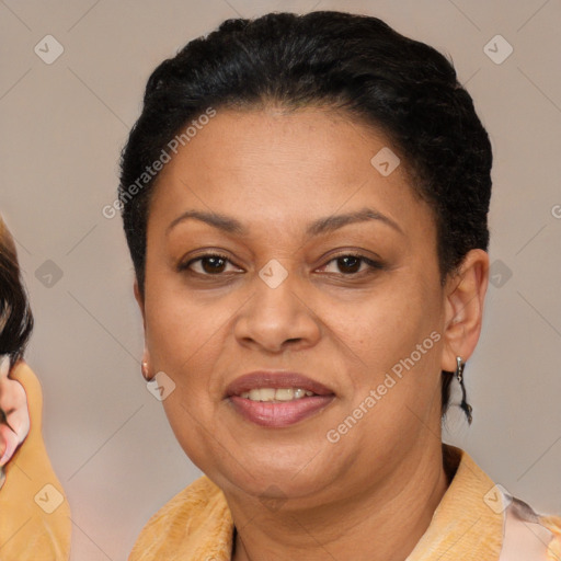 Joyful latino adult female with short  brown hair and brown eyes