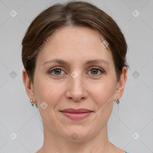 Joyful white adult female with medium  brown hair and grey eyes