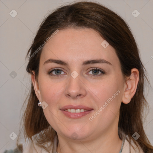 Joyful white young-adult female with medium  brown hair and grey eyes