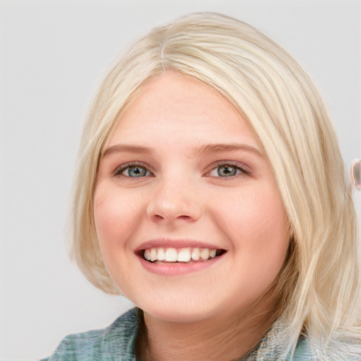 Joyful white young-adult female with medium  brown hair and blue eyes