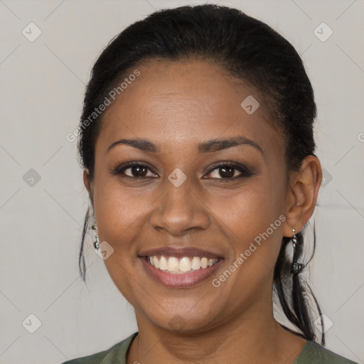 Joyful black young-adult female with medium  brown hair and brown eyes