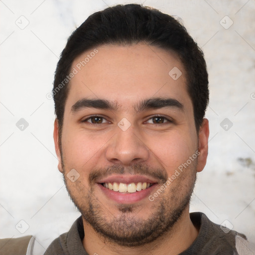 Joyful white young-adult male with short  black hair and brown eyes