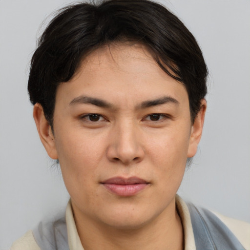 Joyful asian young-adult female with short  brown hair and brown eyes