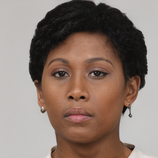 Neutral black young-adult female with short  brown hair and brown eyes