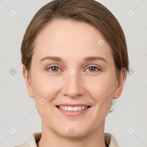 Joyful white young-adult female with short  brown hair and grey eyes