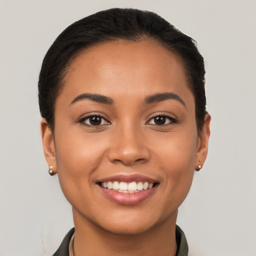 Joyful latino young-adult female with short  brown hair and brown eyes