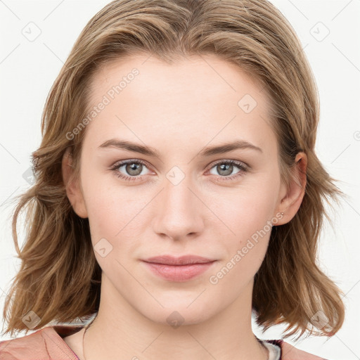 Joyful white young-adult female with medium  brown hair and blue eyes