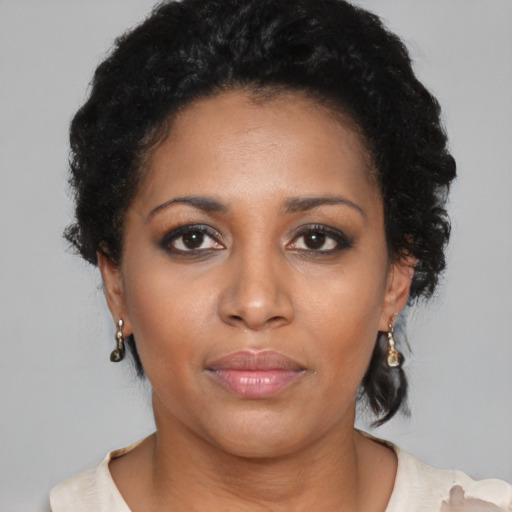 Neutral black young-adult female with short  black hair and brown eyes