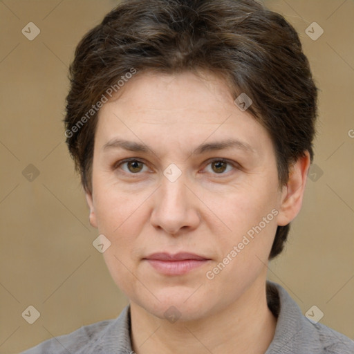 Joyful white adult female with short  brown hair and brown eyes