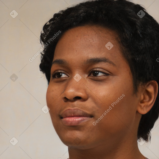 Joyful black young-adult female with short  black hair and brown eyes