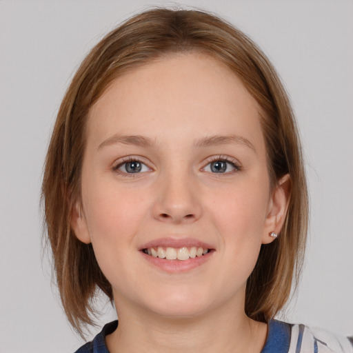 Joyful white young-adult female with medium  brown hair and blue eyes