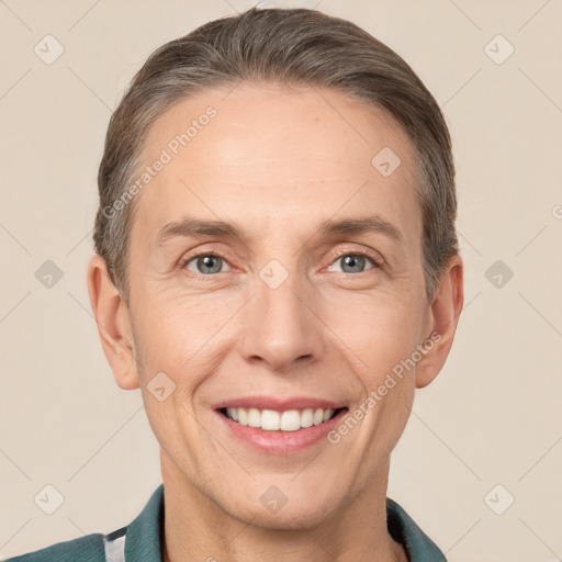 Joyful white adult male with short  brown hair and grey eyes