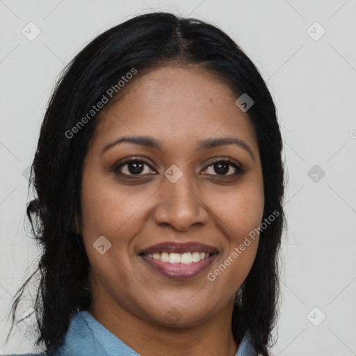Joyful black young-adult female with long  brown hair and brown eyes