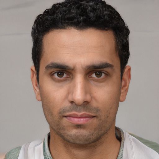 Neutral white young-adult male with short  black hair and brown eyes