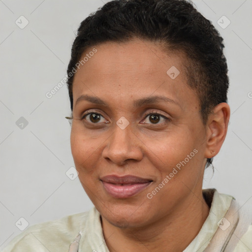 Joyful latino adult female with short  brown hair and brown eyes