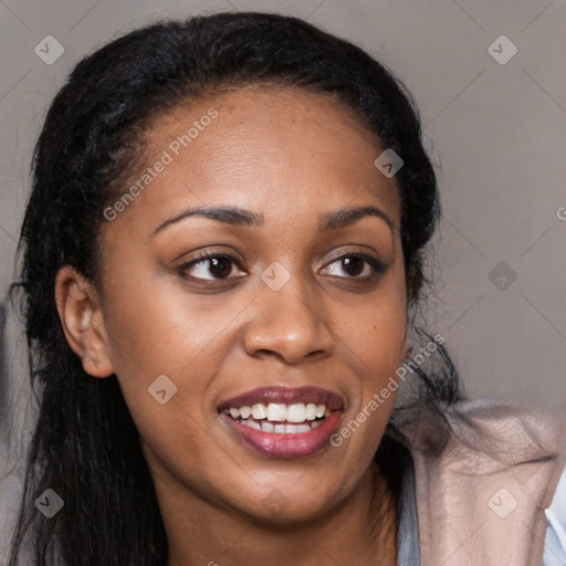 Joyful black young-adult female with long  black hair and brown eyes