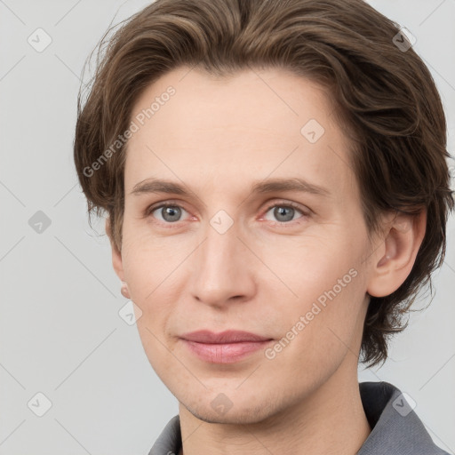 Joyful white young-adult female with short  brown hair and grey eyes