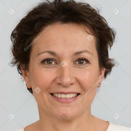 Joyful white adult female with short  brown hair and brown eyes