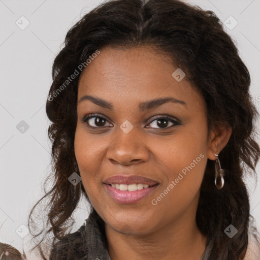 Joyful black young-adult female with long  brown hair and brown eyes