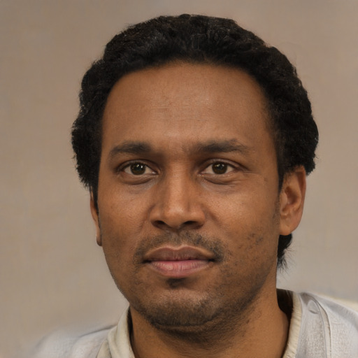 Neutral latino adult male with short  black hair and brown eyes