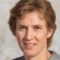 Joyful white adult male with short  brown hair and grey eyes