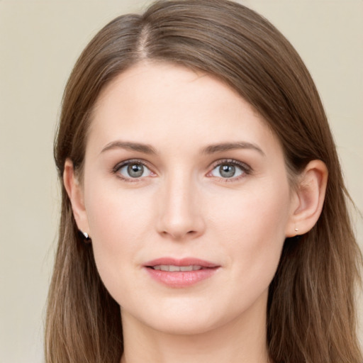 Joyful white young-adult female with long  brown hair and grey eyes