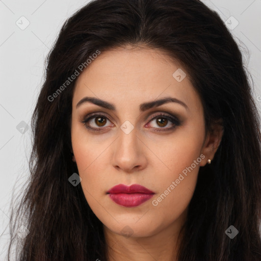 Joyful latino young-adult female with long  brown hair and brown eyes