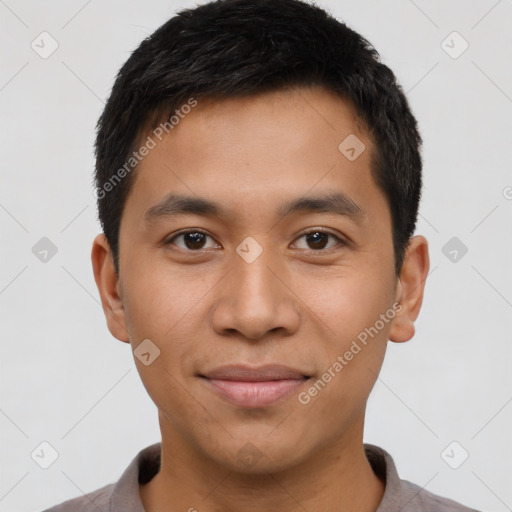 Joyful asian young-adult male with short  brown hair and brown eyes