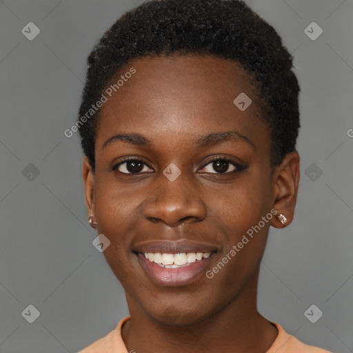 Joyful black young-adult female with short  black hair and brown eyes