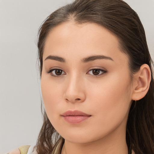 Neutral white young-adult female with long  brown hair and brown eyes