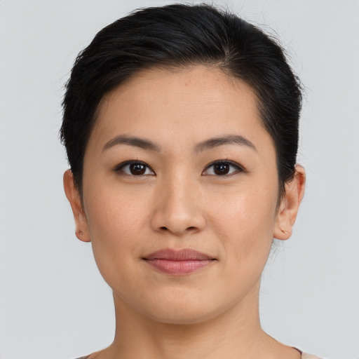 Joyful latino young-adult female with short  brown hair and brown eyes